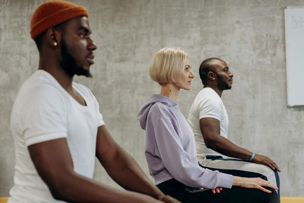Diverse group of people practicing yoga together.